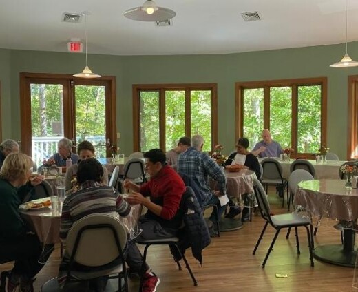 Retreat participants dining in the dining room