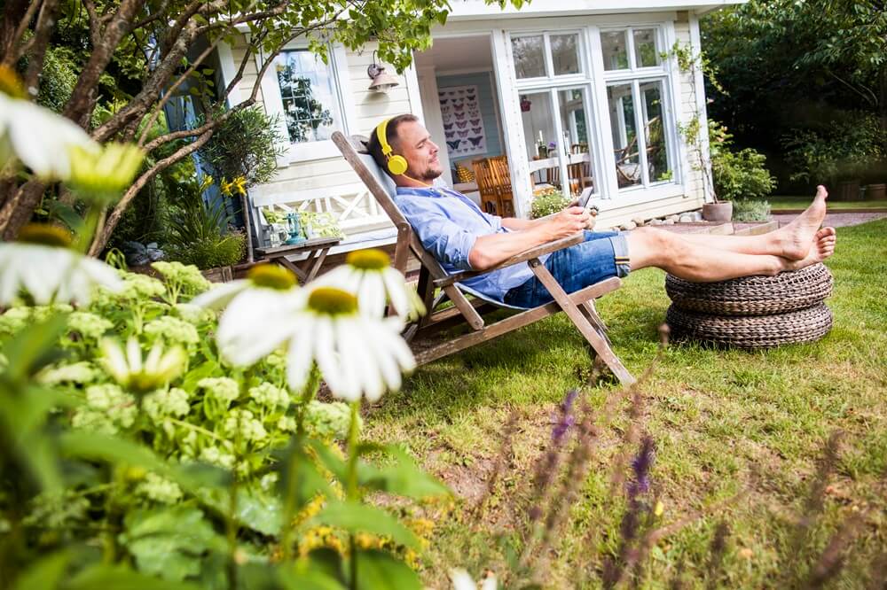 man-meditating-outside-with-headset-and-eyes-closed